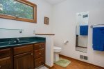 Main level ensuite bathroom with walk in shower and walk in closet